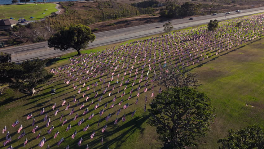 Aerial shot of Waving USA Flags on annual ceremony at Pepperdine University, CA, USA. Shot of honoring the lives lost in the terror attacks on September 09,11, 2001. High quality 4k footage