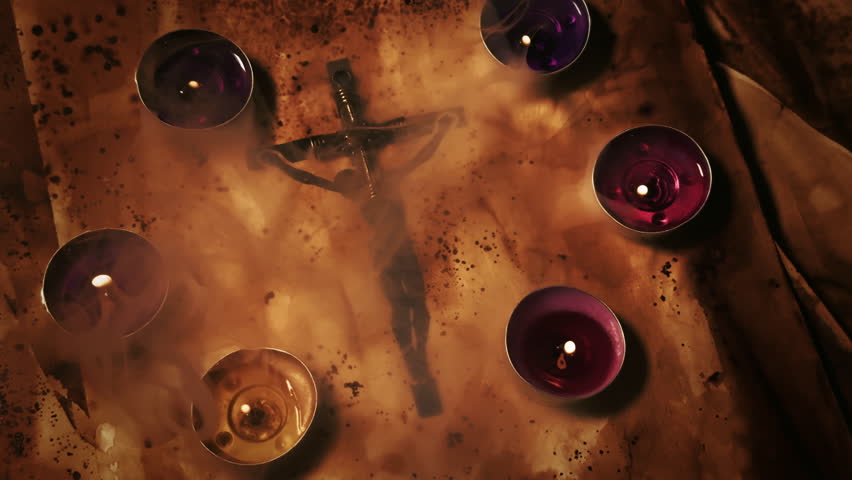 Christian Religion Symbol Jesus Cross on an Old Ancient Parchment in Candle Light