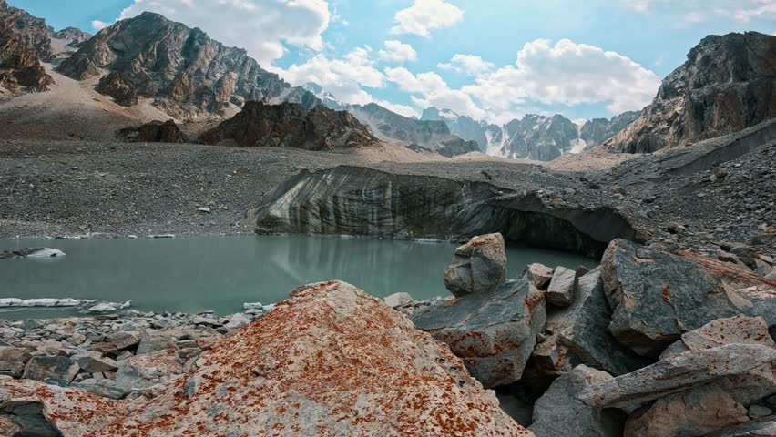 A majestic mountain glacier and a crystal-clear lake