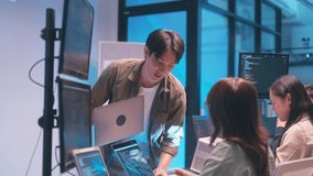 Asian team presents code using a projector during a software development meeting or coding workshop, guiding attendees through problem-solving and programming concepts in an educational setting. - Powered by Shutterstock - Get 15% off with code: PIKWIZARD15