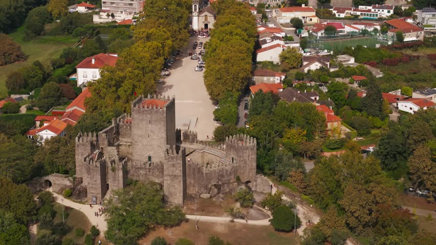Breathtaking aerial of medieval Guimarães Castle overlooking quaint town