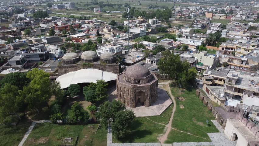 Aerial view of historic Rawat Fort Pakistan containing tomb of Sarang Khan Gakhar king now surrounded by modern settlements