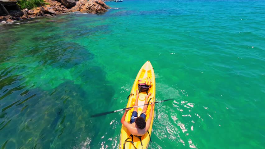 A Man Kayaking On Tropical Waters Of Yelapa Beach On South Of Puerto Vallarta, Mexico. POV Shot