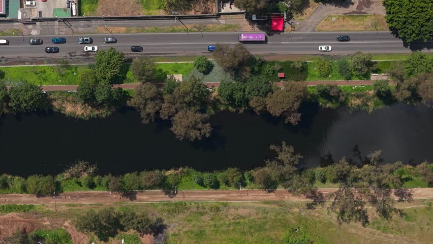 Top-down view of Xochimilco canals alongside streets of Mexico City