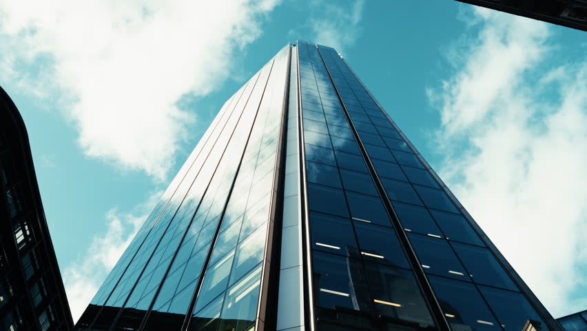 Corporate Skyscraper Touching The Blue Sky 