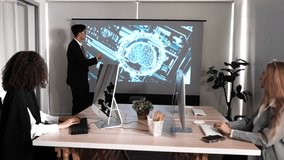 Corporate Business Meeting in Virtual Reality Office Space. A real male manager stands in front of the meeting room and two female specialists sit and listen. Metaverse usage with business concept. - Powered by Shutterstock - Get 15% off with code: PIKWIZARD15