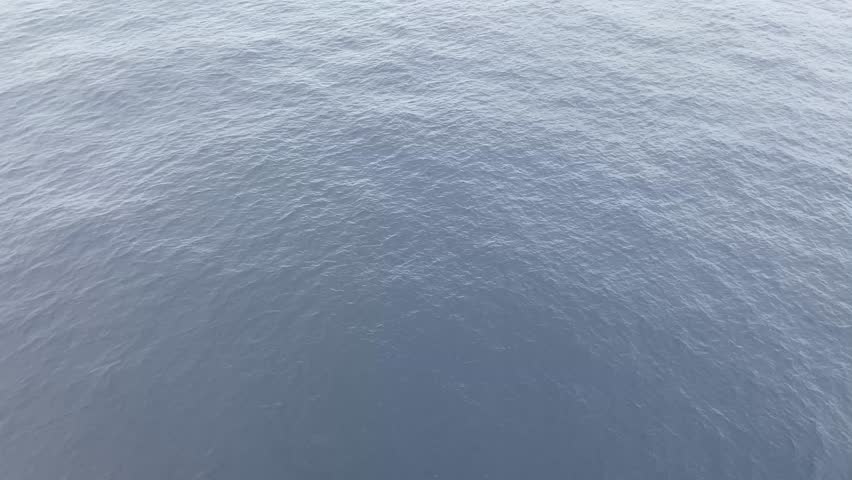 Beautiful Seascape from the Middle of the Ocean with Clouds. A stunning view from the middle of the calm ocean, with peaceful waters and a cloudy sky. A perfect natural landscape, ideal for tranquil 