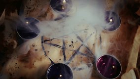 Scary Mystic Pentagram Symbol on an Old Parchment and Candles in Smoke - Powered by Shutterstock - Get 15% off with code: PIKWIZARD15
