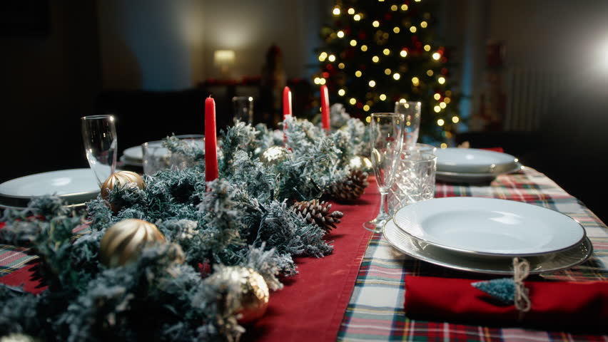 Set Christmas table for family dinner 