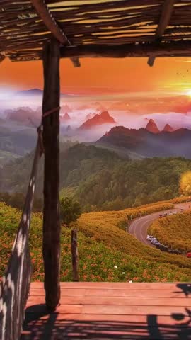 Golden sunrise over mountains, winding road through orange flower fields, inspiring quote: "Do more of what you love."
