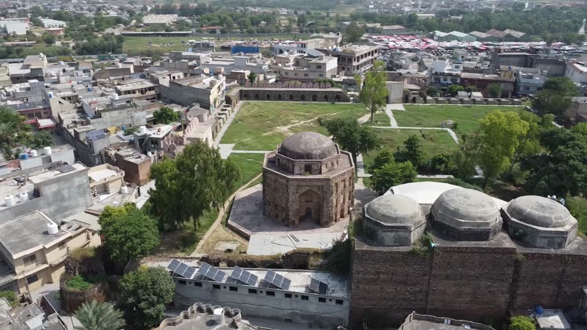 Aerial circular view of historic Rawat Fort in Rawat city Pakistan showing ancient Mughal architecture and heritage site