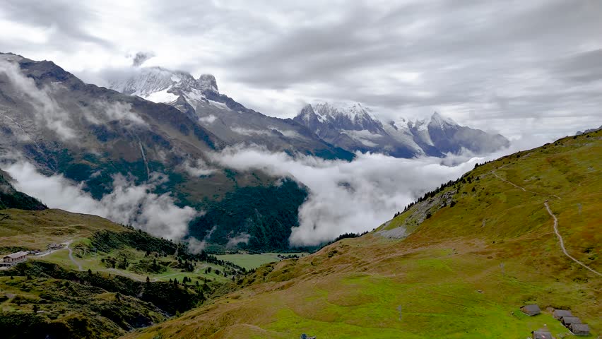 4K high resolution video of the beautiful French Col de Posettes Valley part of the famous TMB- Tour du Mont Blanc Trail during an overcast cloudy and foggy day