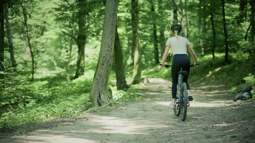 Woman Cycling MTB Bike Riding. Cyclist Mountain Bike. Athlete On MTB Bicycle Cycling In Park. Sport Recreation Fitness Training. Cyclist Cardio Hard Training. Cycling On Hardtail Bike Mtb In Mountain. Woman Cyclist Workout Exercise Cross-Country. Woman Cyclist Fitness Exercising