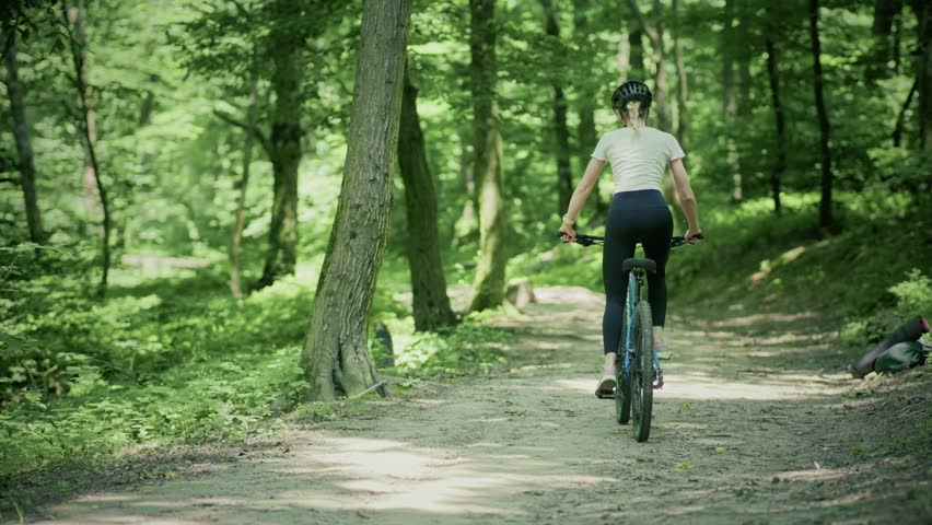 Woman Cycling MTB Bike Riding. Cyclist Mountain Bike. Athlete On MTB Bicycle Cycling In Park. Sport Recreation. Cycling On Hardtail Bike Mtb In Mountain. Woman Cyclist Workout Exercise Cross-Country