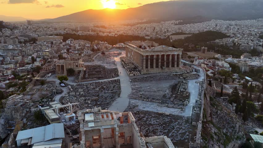 Drone shot of Iconic Parthenon and Ancient Ruins in Athens, Greece at sunrise. Aerial View of Athens Ancient Acropolis, travel in Greece