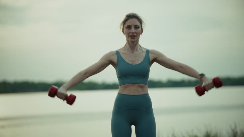 Sport Workout Outdoor Fitness. Strength Training Muscle Toning. Fitness Exercising Physical Activity. Sport Recreation Fitness Dedication.Sporty Woman Exercising Motivation Achievement Workout Routine