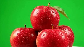 Stacked red apples with fresh water droplets against a vibrant green background, symbolizing freshness, health, and organic fruit concepts. - Powered by Shutterstock - Get 15% off with code: PIKWIZARD15