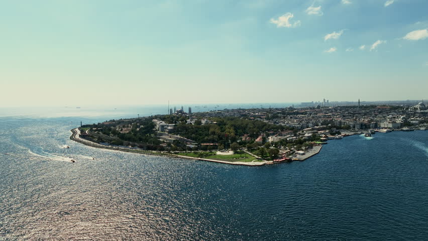 Aerial view of Hagia Sophia, Blue Mosque, Topkapi Palace from the Bosphorus. Istanbul skyline from the Bosphorus. The historical peninsula and the Turkish flag. Sirkeci, Istanbul, Turkey