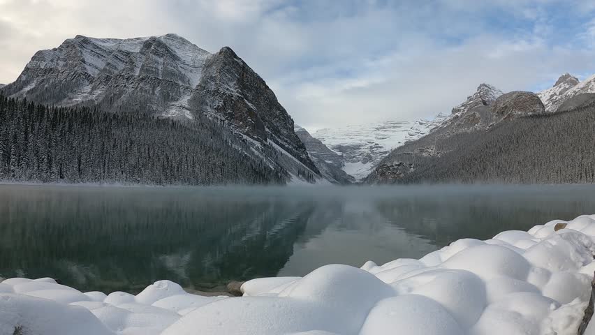 The green water reflects the vibrant greenery, showcasing the untouched natural beauty of the wilderness. This cinematic scene perfect for projects related to eco-tourism, environmental conservation