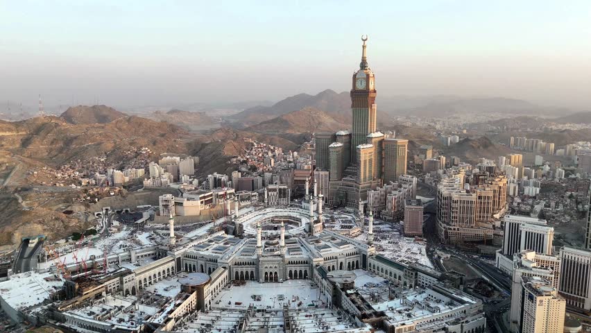 Aerial view Mecca skyline , Makkah city Saudi Arabia -  Makkah Clock Tower and hotels  - Masjid Al Haram 4k drone Video