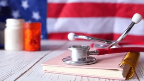 American Healthcare: Stethoscope, Pills, and American Flag 4k video - Powered by Shutterstock - Get 15% off with code: PIKWIZARD15