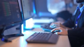 In a modern, blue-lit office, professionals' hands fly across keyboards, showcasing a high-speed digital workflow, intense data processing, and corporate workforce productivity. - Powered by Shutterstock - Get 15% off with code: PIKWIZARD15