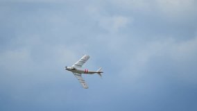 MiG-17 fighter jet flying in sky at airshow performance. Aviation heritage, Cold War history, military technology, aerospace engineering.  - Powered by Shutterstock - Get 15% off with code: PIKWIZARD15
