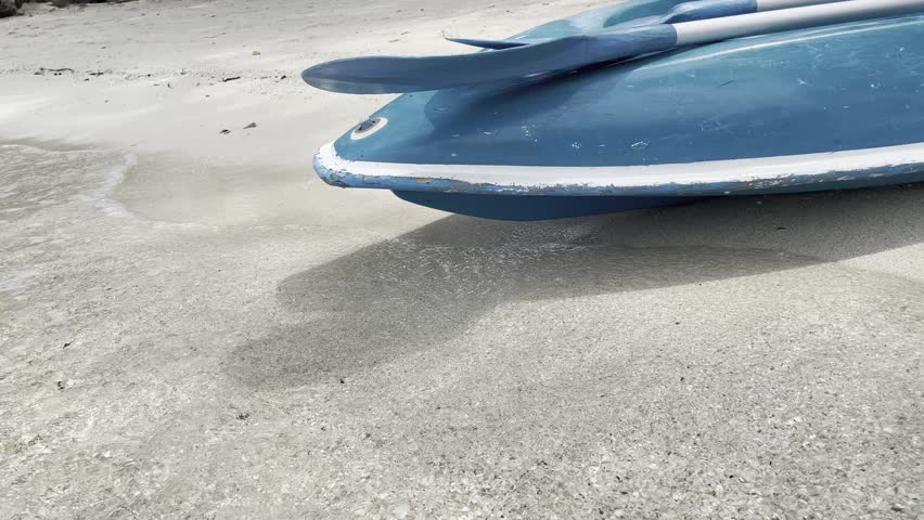 Canoe on a sand beach