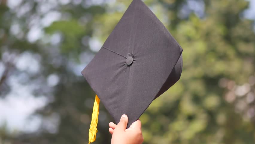 Student hold hats in hand during commencement success 4k video