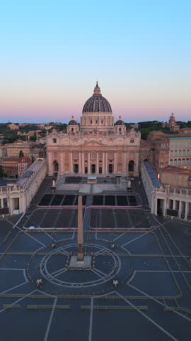 Captivating aerial views of the magnificent St. Peters Basilica along with the Vatican, beautifully showcasing the stunning architecture and the serene ambiance of a calm dawn. Rome, Italy