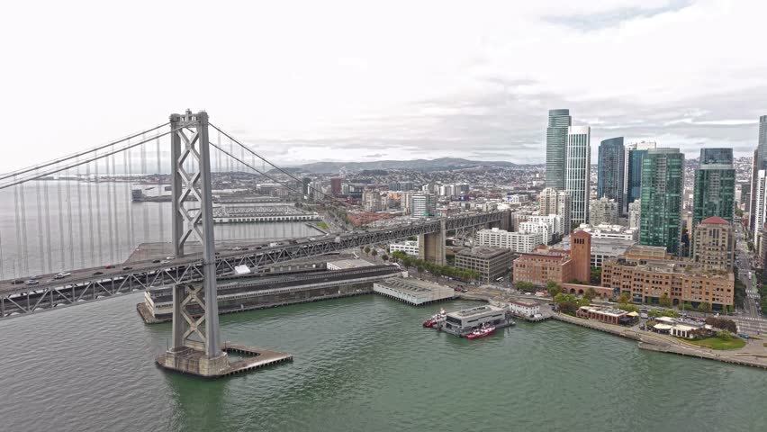 Aerial View of San Francisco Cityscape Skyline From Waterfront and Oakland Bay Bridge Traffic, California USA