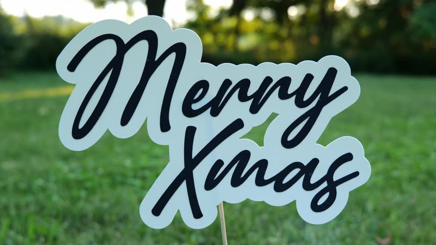 Message of the words Merry Xmas Outdoors in Nature at Merry Christmas Card 4k Video Stock Footage