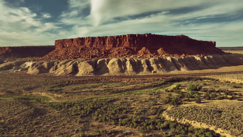 Aerial drone view of desert landscape with mountains and rural houses in New Mexico, USA