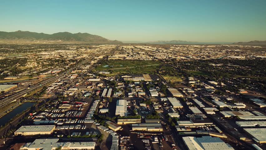 Aerial drone flight over Salt Lake City highways, cars, and nature, Utah, USA