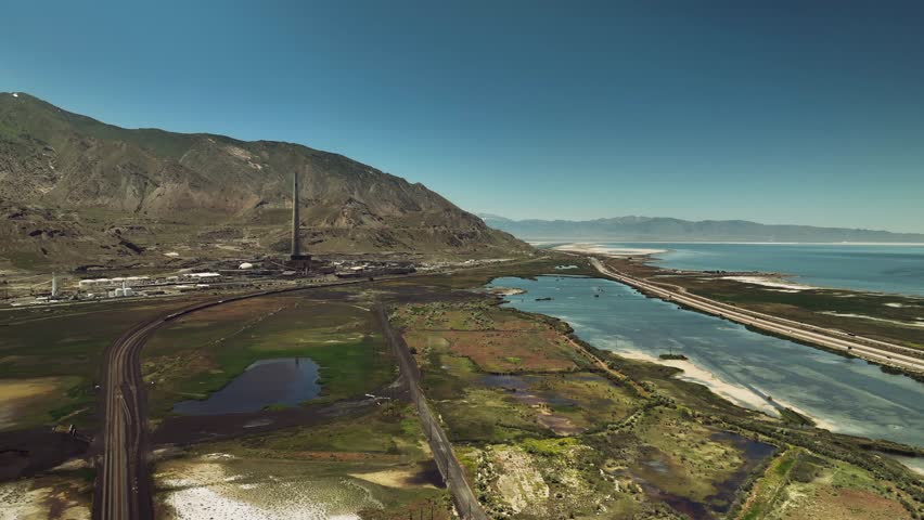 Aerial drone view of Great Salt Lake with mountains, nature and roads, Utah, USA