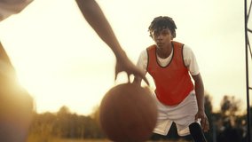 Sport for adolescents, african american teenagers playing basketball outdoors. Cinematic slow motion inside streetball match, young black players training together, exercise and practice for juniors - Powered by Shutterstock - Get 15% off with code: PIKWIZARD15