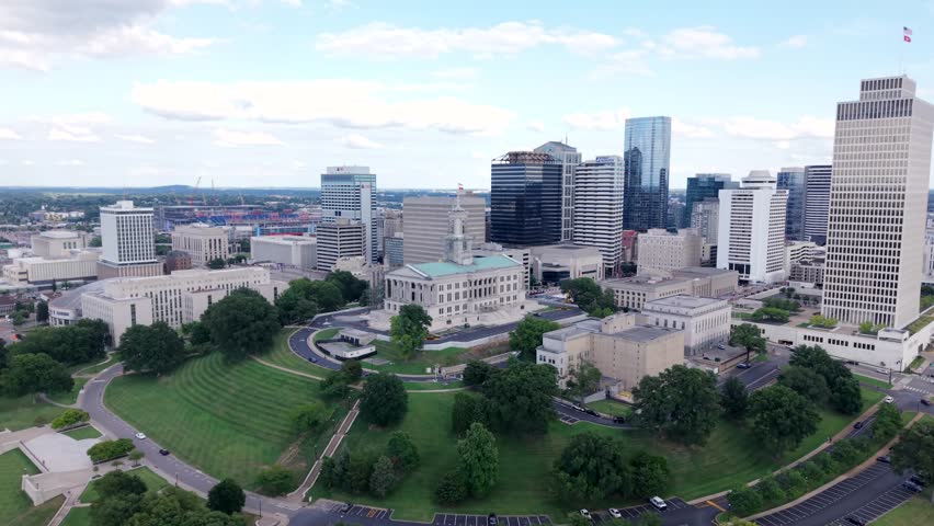 State Capitol building And City Skyline During Summer In Downtown Nashville, Tennessee. Aerial Parallax Shot.