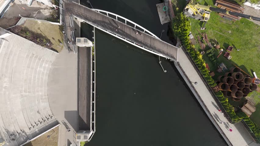 Aerial view of the Opera Nova complex and footbridge over the river Brda, a blend of urban architecture and nature