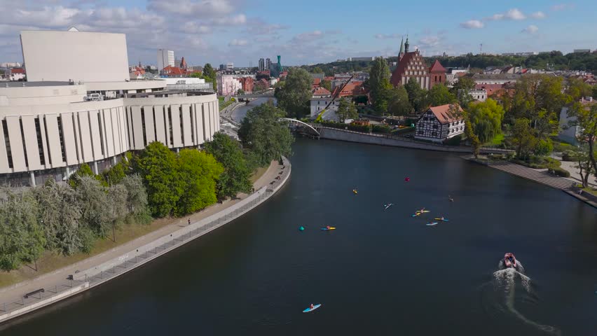 Aerial view of the modern Opera Nova contrasting with the historic cityscape and the river Brda flowing through Bydgoszcz, Bydgoszcz, Kuyavian-Pomeranian Voivodeship, Poland.