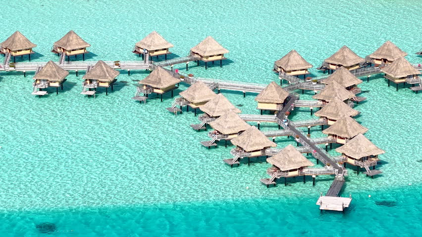 Bora Bora Island, French Polynesia. Drone Shot of Luxury Bungalows Above Turquoise Water