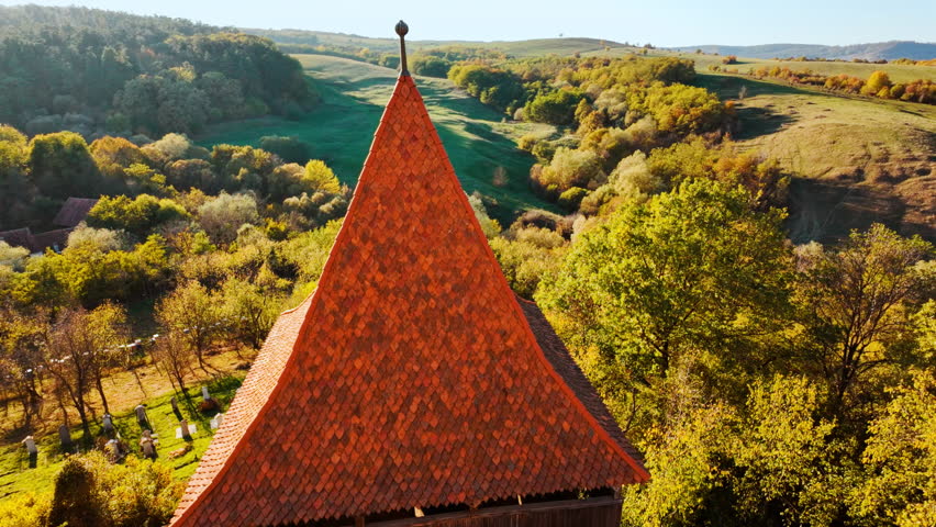 Viscri fortified church and the surrounding village and countryside, Transylvania, Romania, unites a hilltop church, enclosing walls, cobbled lanes, and open fields
