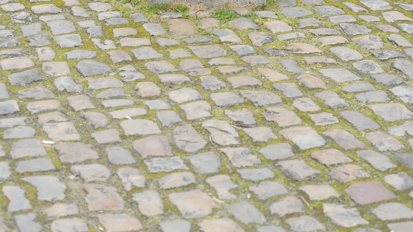 Madonna and child sculpture in Bruges, Belgium: slide from the pavement to the sculpture and zoom in