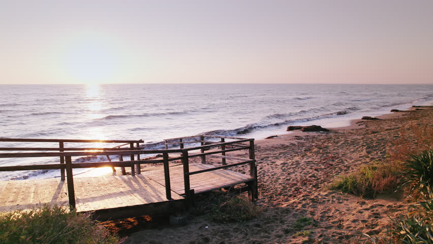 Early Dawn on Long Beach: Old Stairs and Calming Waves in Iskele, Northern Cyprus