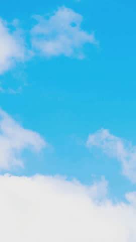 A tranquil time-lapse from an airplane window shows soft white clouds drifting over a deep blue sky, capturing serene aerial motion and expansive natural beauty, perfect for travel or relaxation theme