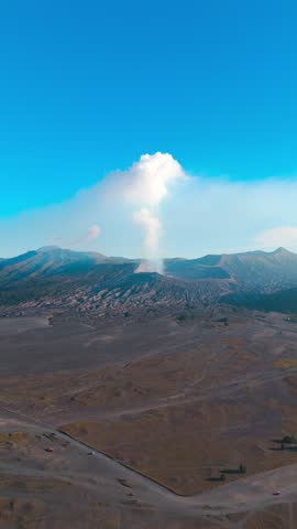 Vertical, aerial: Bromo-Tengger-Semeru volcano chain during the day in East Java, Indonesia, orbit drone shot