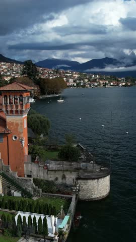 A Serene View of Como Lake, Italy, Surrounded by Beautiful Buildings