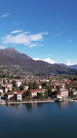 A Serene Aerial View of Como Lake Surrounded by Majestic Mountains and the Charming City of Italy