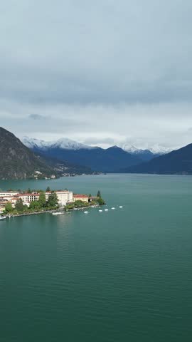 A Serene Town Nestled by the Majestic Como Lake with Breathtaking Mountain Backdrop