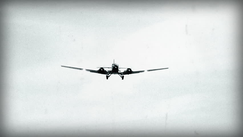 An 8mm (faked) Black & White shot. Historic airplane, Junkers JU 52 (Nickname "Tante JU") fly over super close. No recognizable people, trademarks or logos! 10922 