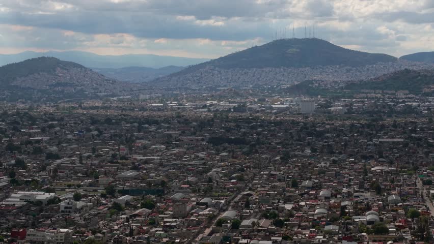 Aerial shot of Ecatepec's landscape in Mexico, with a telephoto parallax effect